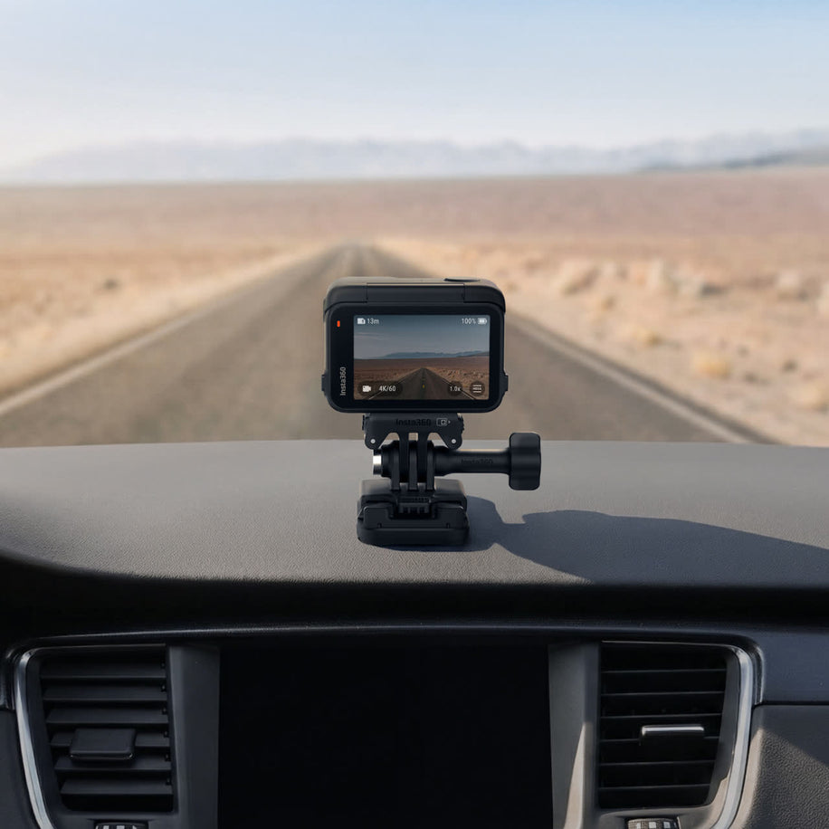 insta360 adhesive mount kit — Mounted on car dashboard, in use
