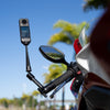 Insta360 Motorcycle Magic Arm — Mounted by motorcycle mirror, riding shot