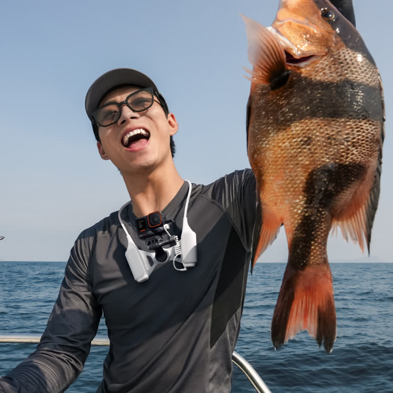 Insta360 FOMO Power Neck Mount — Fishing usage shot, camera on neck mount
