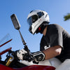 Insta360 Motorcycle Magic Arm — Rider adjusting arm on handlebar