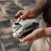 antigravity a1 — Folded drone held in hands, scale shot