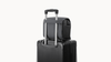 Antigravity A1 Sling Bag — Bag attached to suitcase trolley handle