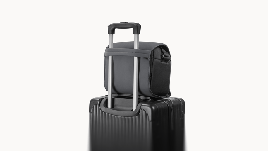 Antigravity A1 Sling Bag — Bag attached to suitcase trolley handle